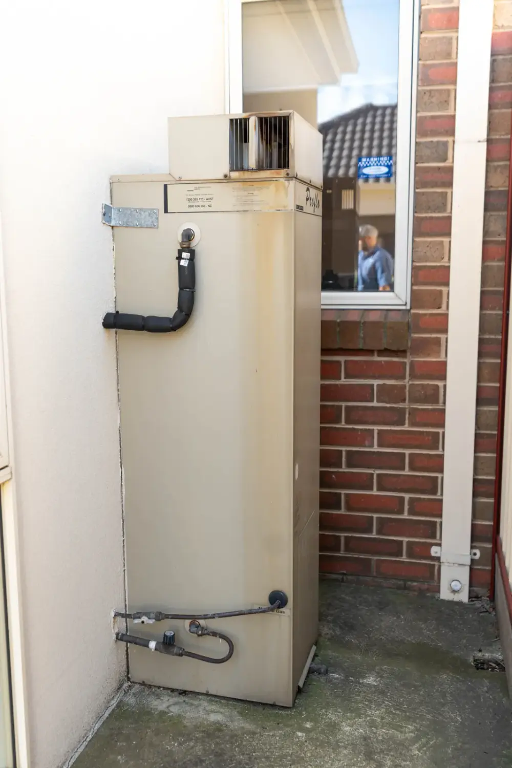 Energy-efficient hot water unit installed outside a local home